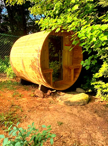 Cedar barrel sauna exterior at Cowan Cove, West Asheville